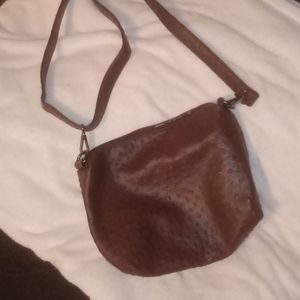 Textured Leather Crossbody bag In Brown With Leopard Print Satin Inside.